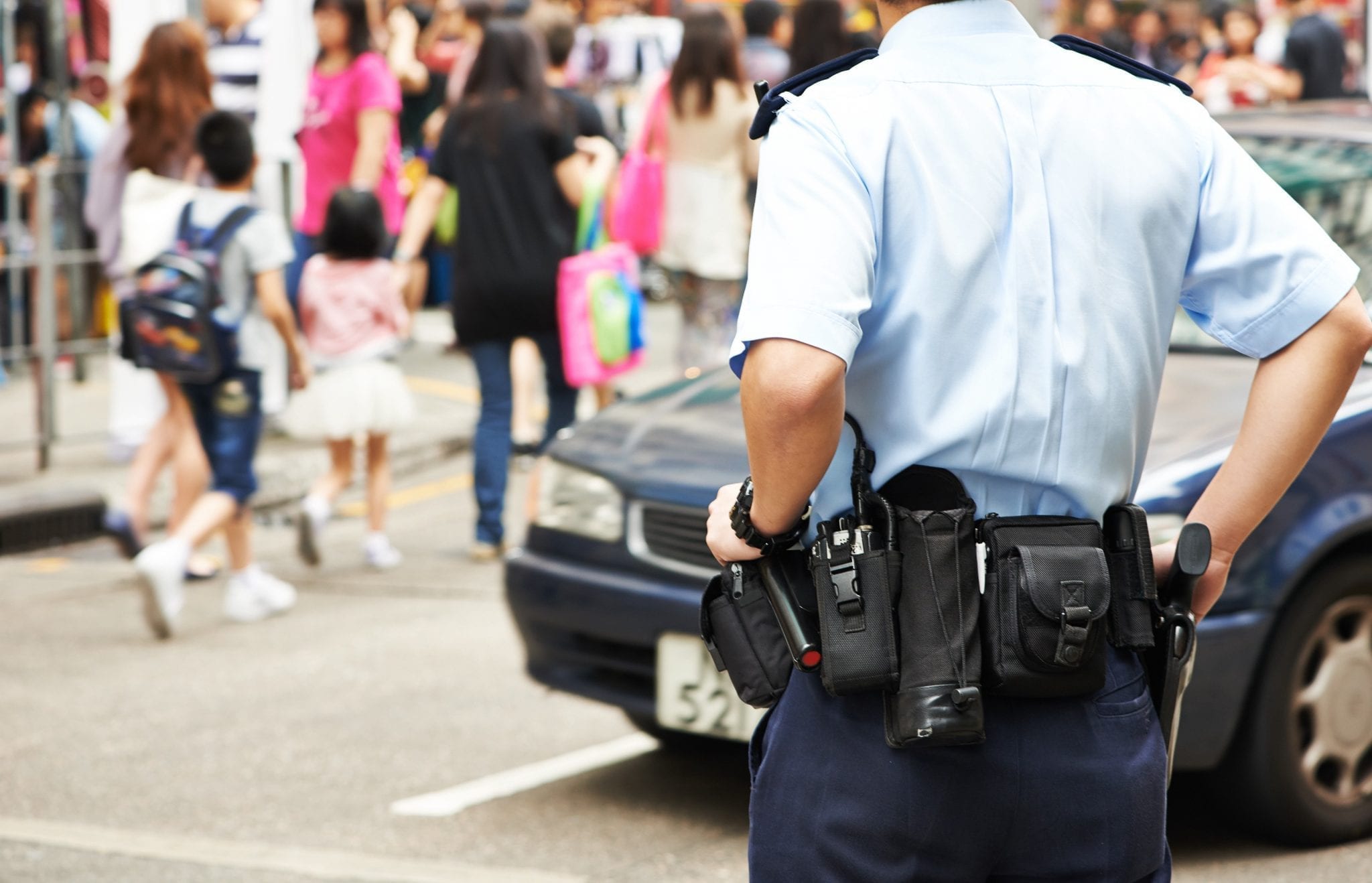 Police Officer with his two radio in his belt holder